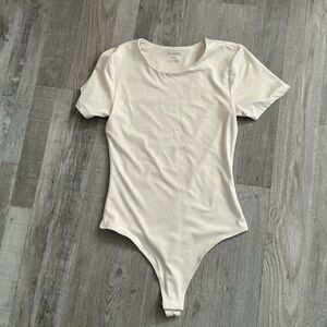 Cream short sleeve crewneck thong bodysuit